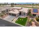 Aerial view of house with solar panels, landscaping, and golf course view at 3182 N 159Th Dr, Goodyear, AZ 85395