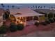 Aerial view of house at dusk with backyard patio at 3182 N 159Th Dr, Goodyear, AZ 85395