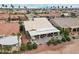 Aerial view of house with large backyard, covered patio, and hot tub at 3182 N 159Th Dr, Goodyear, AZ 85395