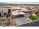 Aerial view of house with solar panels, landscaping, and golf course view at 3182 N 159Th Dr, Goodyear, AZ 85395