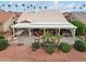 Large backyard with covered patio, hot tub, and outdoor kitchen at 3182 N 159Th Dr, Goodyear, AZ 85395