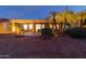Evening view of backyard patio with fire pit and seating at 3182 N 159Th Dr, Goodyear, AZ 85395