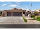 Two-story home with landscaped yard, three-car garage, and attractive exterior at 3182 N 159Th Dr, Goodyear, AZ 85395
