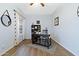 Charming home office with built-in shelving and wood flooring at 3182 N 159Th Dr, Goodyear, AZ 85395