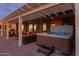 Hot tub on patio with pergola and seating area at 3182 N 159Th Dr, Goodyear, AZ 85395