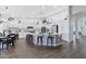 Modern kitchen with white cabinets and large island at 3182 N 159Th Dr, Goodyear, AZ 85395