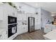 White kitchen with stainless steel appliances at 3182 N 159Th Dr, Goodyear, AZ 85395