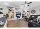 Living room with built-in shelving and large TV at 3182 N 159Th Dr, Goodyear, AZ 85395