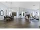 Open-concept living and dining area with hardwood floors at 3182 N 159Th Dr, Goodyear, AZ 85395