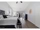 Main bedroom with king bed, stylish decor, and patio access at 3182 N 159Th Dr, Goodyear, AZ 85395