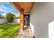 Front entry with wood columns and a black door at 3632 E Cotton Ct, Gilbert, AZ 85234