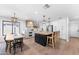 Modern kitchen with island, stainless steel appliances, and white shaker cabinets at 3632 E Cotton Ct, Gilbert, AZ 85234