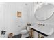 Modern powder room with a pedestal sink and hexagon tile floor at 3632 E Cotton Ct, Gilbert, AZ 85234