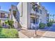 Inviting condo exterior featuring a charming facade, desert landscaping, and stairs leading to upper units at 3640 N 38Th St # 104, Phoenix, AZ 85018