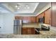 Kitchen view showcasing stainless steel appliances, granite countertops, and modern cabinetry at 3640 N 38Th St # 104, Phoenix, AZ 85018