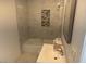 Clean bathroom with updated tile and bathtub at 4127 E Maldonado Dr, Phoenix, AZ 85042