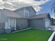 Two-story house with gray exterior and artificial turf front yard at 4127 E Maldonado Dr, Phoenix, AZ 85042