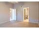 Bright bedroom with carpet flooring and access to a bathroom at 4135 N 17Th St # 11, Phoenix, AZ 85016