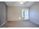 Bedroom with carpet flooring, sliding door, and pet door at 4135 N 17Th St # 11, Phoenix, AZ 85016