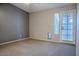 Bedroom with carpet flooring, sliding door, and pet door at 4135 N 17Th St # 11, Phoenix, AZ 85016