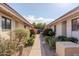 Well-maintained building exterior with landscaped walkway and desert plants at 4135 N 17Th St # 11, Phoenix, AZ 85016
