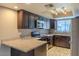 Modern kitchen with dark cabinets and granite counters at 4135 N 17Th St # 11, Phoenix, AZ 85016