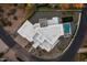 Expansive aerial view of a luxury home featuring a spacious layout, pool, and beautifully landscaped grounds at 4414 E Vermont S Ave, Phoenix, AZ 85018