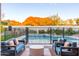 Inviting backyard oasis featuring a sparkling pool, comfortable seating, and a stunning mountain view at 4414 E Vermont S Ave, Phoenix, AZ 85018