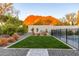 Lush backyard featuring a well-maintained lawn, garden beds, pool and scenic mountain views at 4414 E Vermont S Ave, Phoenix, AZ 85018
