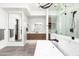 Sleek bathroom featuring a soaking tub and a modern shower with black fixtures and a floating vanity at 4414 E Vermont S Ave, Phoenix, AZ 85018