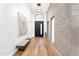 Stylish hallway with hardwood floors, modern lighting, and decorative art at 4414 E Vermont S Ave, Phoenix, AZ 85018
