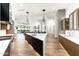 Gourmet kitchen with a center island, sleek countertops, and stainless steel appliances at 4414 E Vermont S Ave, Phoenix, AZ 85018