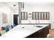 Bright kitchen featuring a center island with bar seating and sleek cabinetry at 4414 E Vermont S Ave, Phoenix, AZ 85018