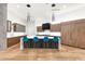 Spacious kitchen featuring a large island with bar seating and modern appliances at 4414 E Vermont S Ave, Phoenix, AZ 85018