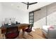 Spacious office includes sleek desk, modern lighting, and barn door access for privacy and style at 4414 E Vermont S Ave, Phoenix, AZ 85018