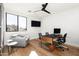 Bright home office offers ample natural light, modern furnishings, and a sleek design conducive to productivity at 4414 E Vermont S Ave, Phoenix, AZ 85018