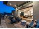 Luxurious outdoor living space with comfortable seating, outdoor kitchen, and seamless indoor-outdoor flow at 4414 E Vermont S Ave, Phoenix, AZ 85018