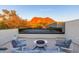 Enjoy outdoor living with a firepit and seating, set against a backdrop of scenic mountain views at 4414 E Vermont S Ave, Phoenix, AZ 85018