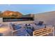 Relax on this rooftop patio with a firepit and stylish seating offering a cozy outdoor experience at 4414 E Vermont S Ave, Phoenix, AZ 85018