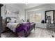 Bright bedroom with large window and wood-look floors at 4455 E Paradise Village S Pkwy # 1031, Phoenix, AZ 85032