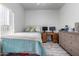Bedroom with wood-look floors and teal bedding at 4455 E Paradise Village S Pkwy # 1031, Phoenix, AZ 85032