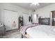 Bedroom with double doors and built-in shelving at 4455 E Paradise Village S Pkwy # 1031, Phoenix, AZ 85032