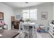 Bright dining area with a white table and chairs, overlooking a view at 4455 E Paradise Village S Pkwy # 1031, Phoenix, AZ 85032