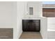 Bright bathroom featuring dark wood cabinets, a white countertop, and modern fixtures at 4828 N 177Th Ln, Goodyear, AZ 85395