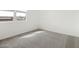 Bright bedroom with a large window providing ample natural light and neutral carpet at 4828 N 177Th Ln, Goodyear, AZ 85395