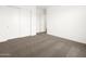 This large bedroom is equipped with carpet and a double closet at 4828 N 177Th Ln, Goodyear, AZ 85395