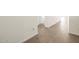 Bright hallway featuring wood-style tile floors and clean, white walls at 4828 N 177Th Ln, Goodyear, AZ 85395