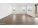 Open living room filled with natural light and wood-look tile flooring at 4828 N 177Th Ln, Goodyear, AZ 85395