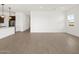 Open-concept living area leading to kitchen with a breakfast bar and island at 4828 N 177Th Ln, Goodyear, AZ 85395