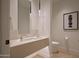 Modern bathroom with floating vanity, stylish lighting, and sleek fixtures offers a spa-like experience at 5000 N Camelback Ridge Rd # 109, Scottsdale, AZ 85251